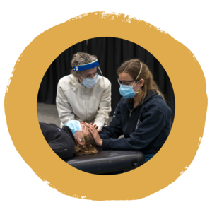 Dr. Giusti teaching a student cranial techniques in the OMM Lab. She is the lead researcher for the DO Perception Study.