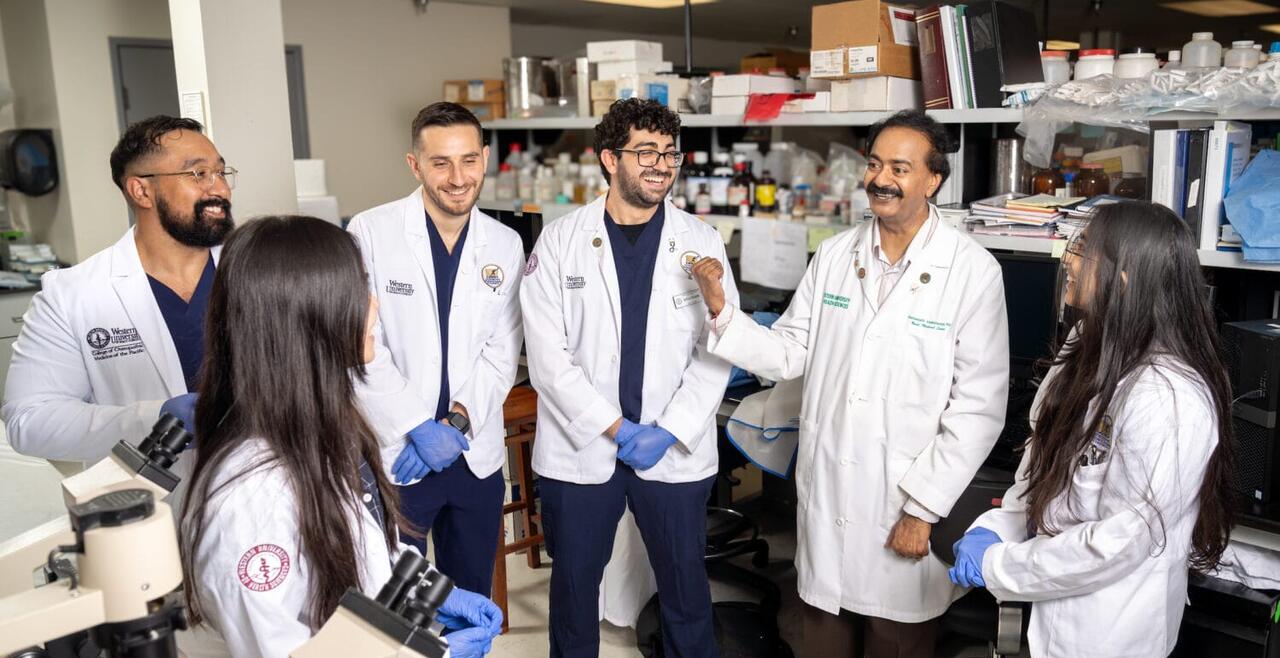 Photo of Dr. Vishwanath Venketaraman with COMP student researchers in his lab. (Jeff Malet, WesternU)