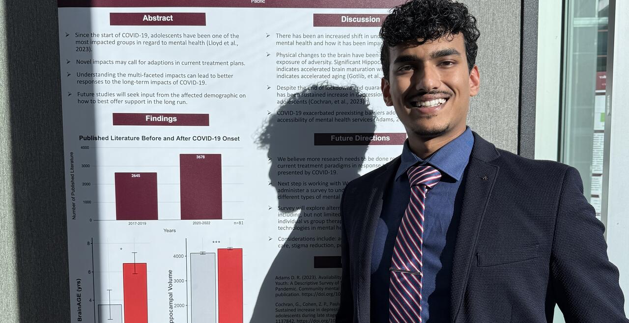 Ankith Arun, DO 2027, standing beside his research poster in December 2024.