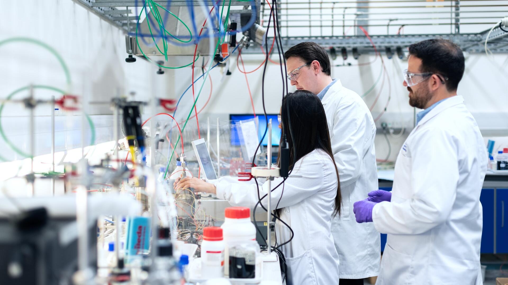 researcher with glass flask