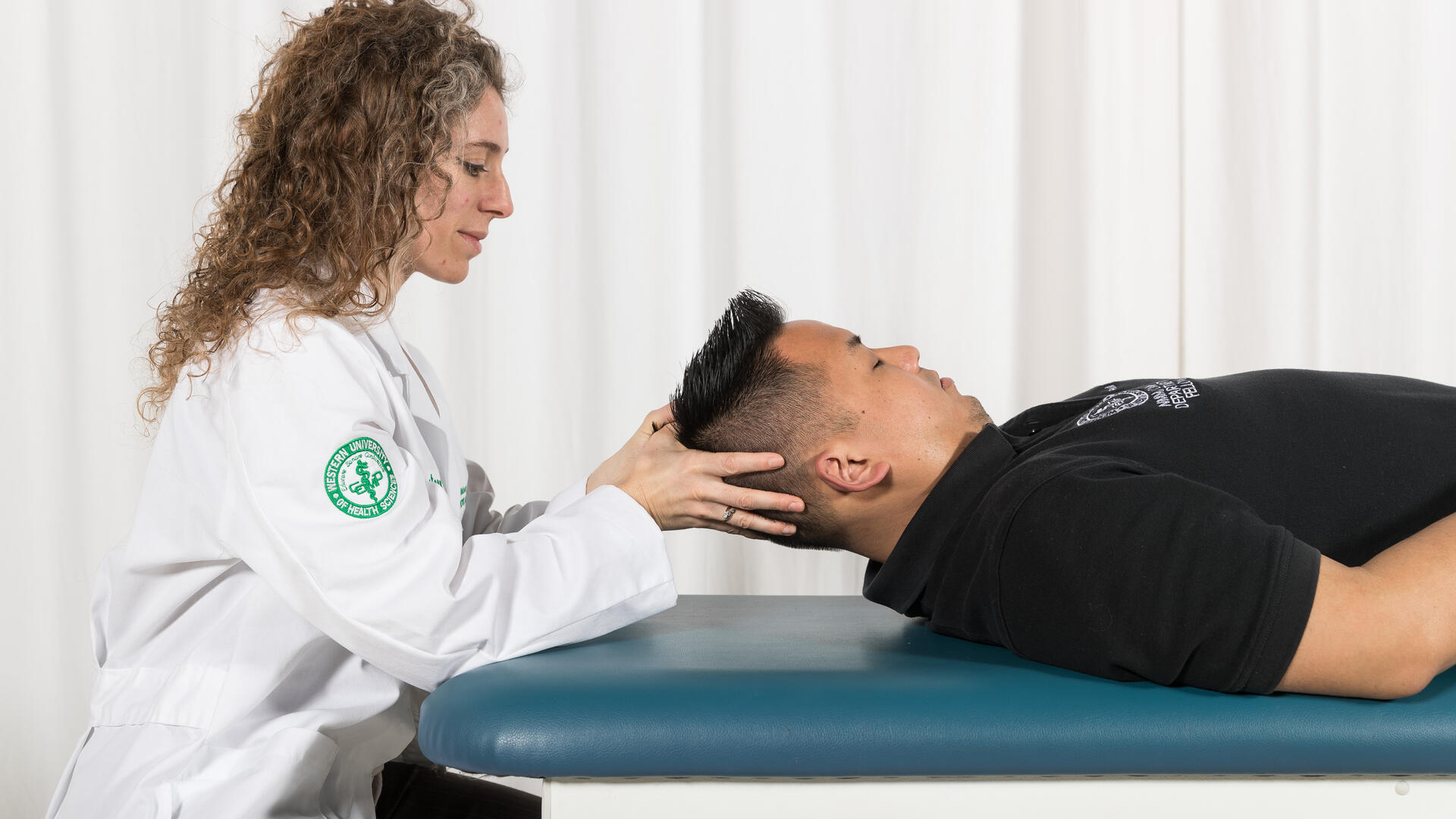 Osteopathic physician applying cranial manipulations